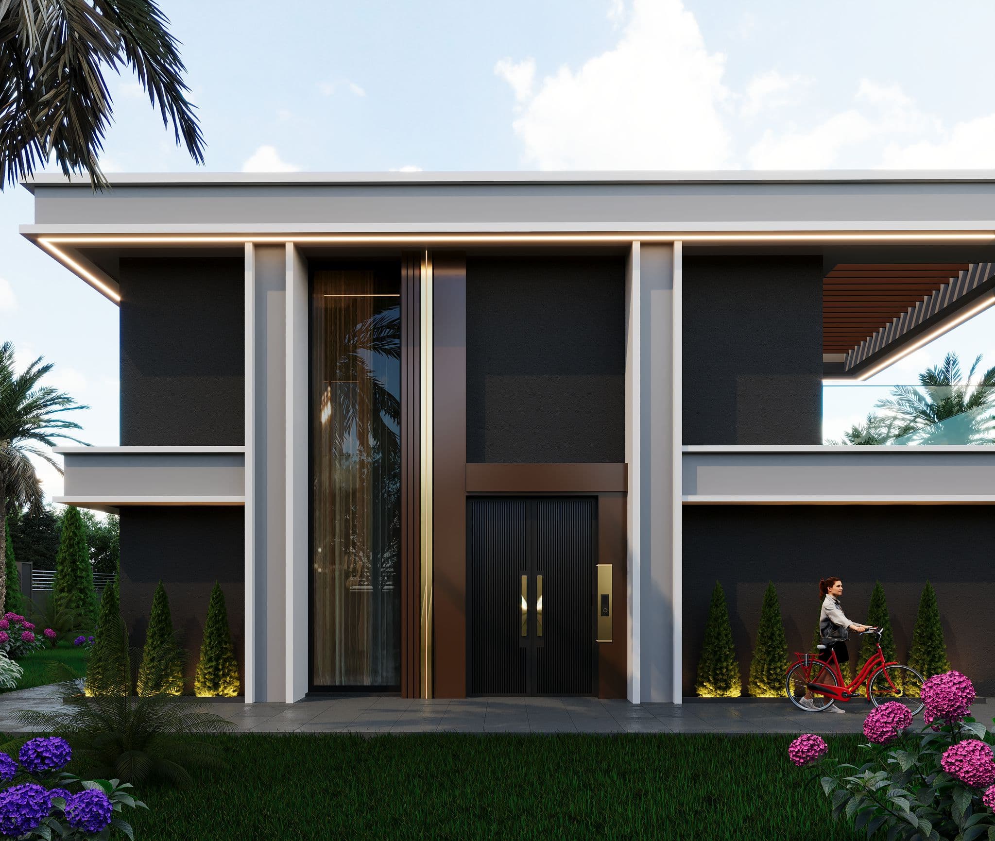 Villa entrance with tall double doors, columnar frame, and symmetrical landscaping