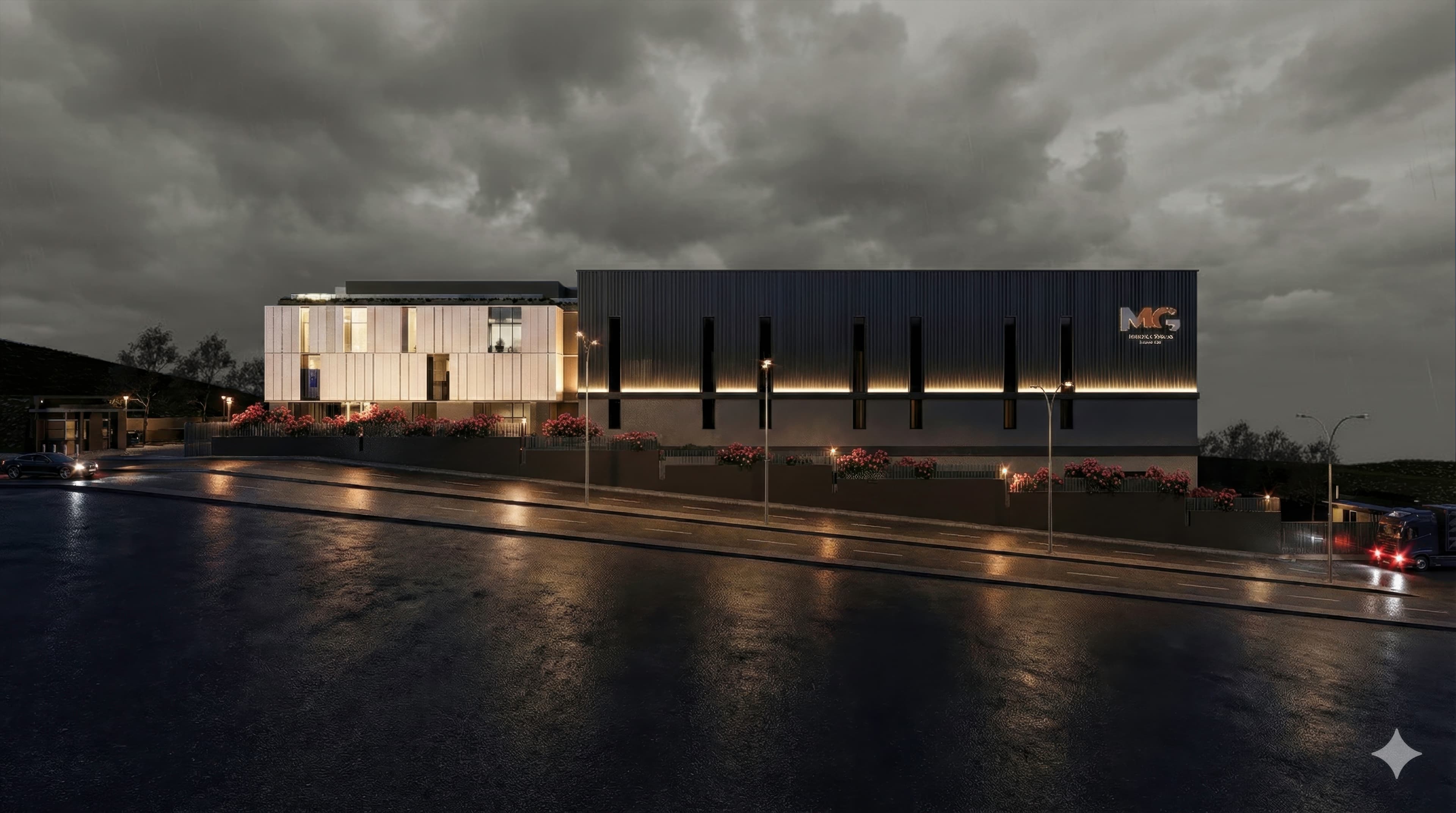 Night view of illuminated steel facility along a wet road under overcast sky