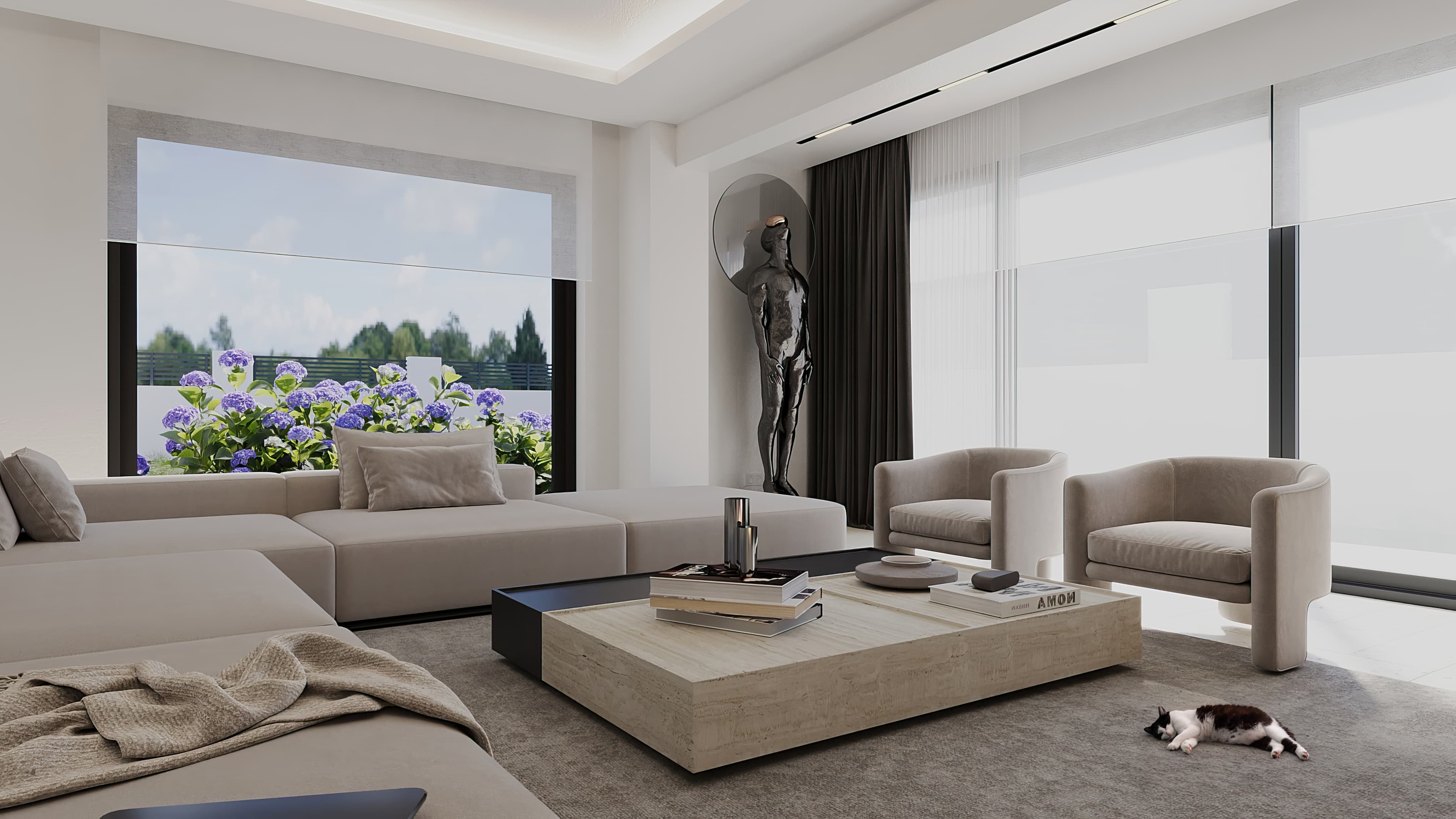 Wide living room with sofa arrangement, sculpture, armchairs, and garden window