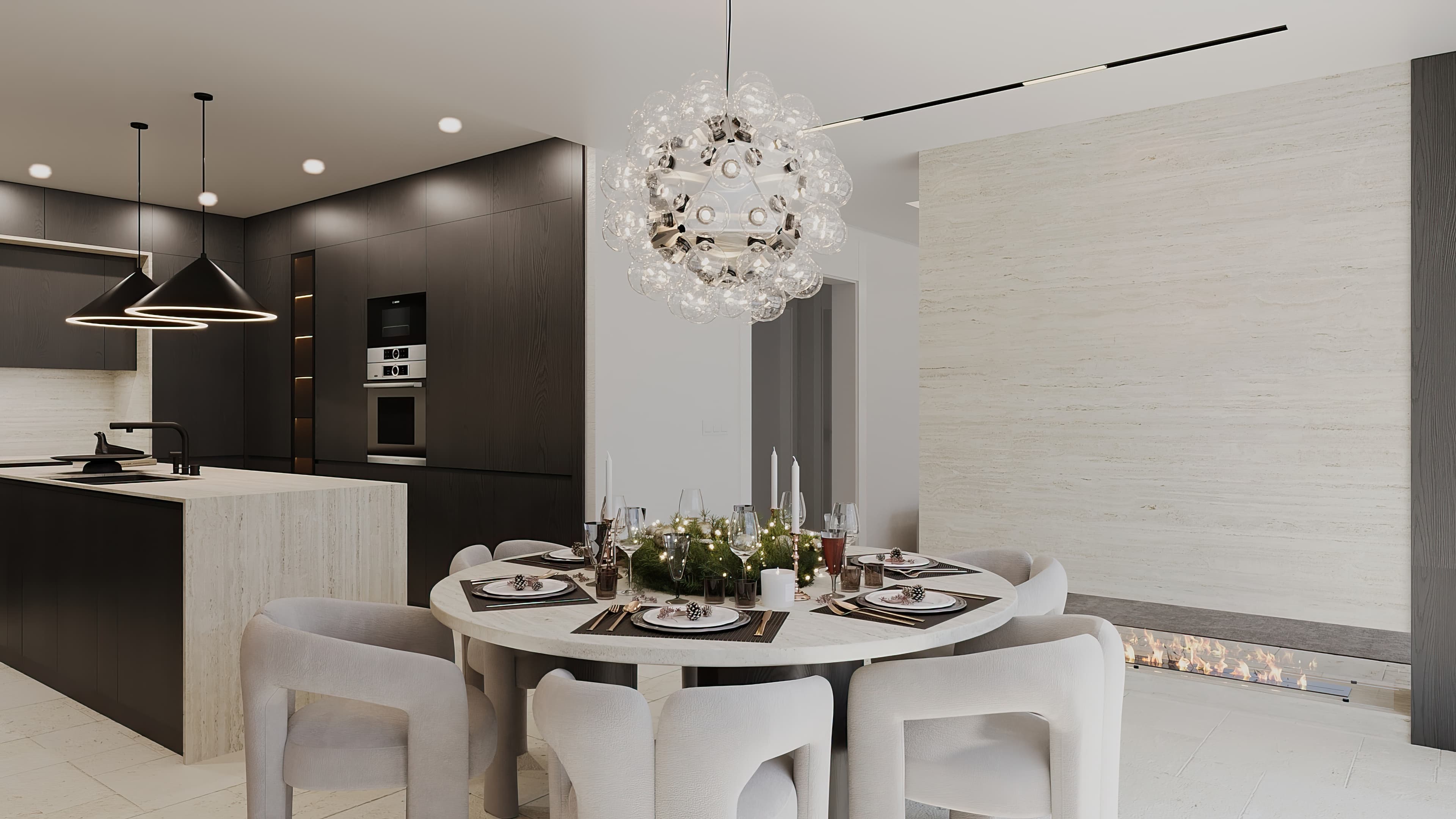 Dining area with round table, bubble chandelier, and open kitchen beyond