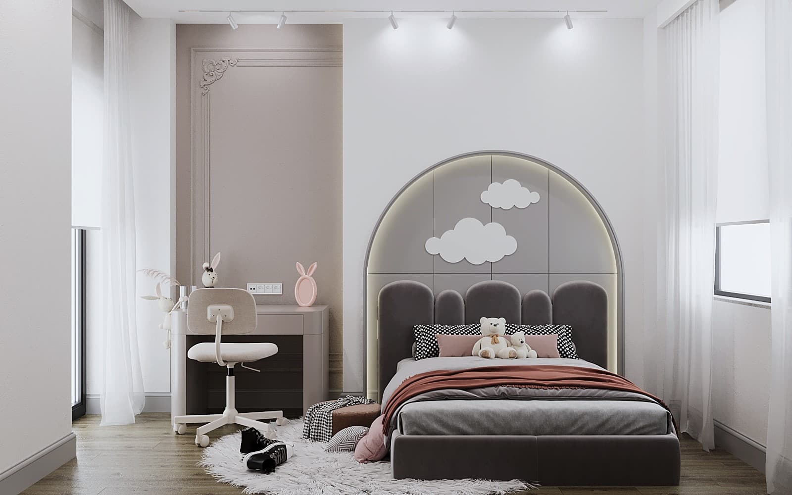Young girl's room with arch headboard, cloud wall art, and pink desk
